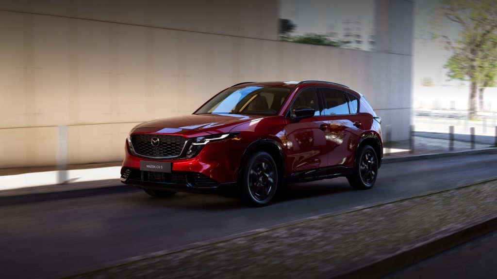 Red 2026 Mazda CX-5 compact SUV driving on the road
