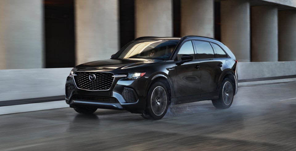 a black Mazda CX-70 drives in Shiloh, IL